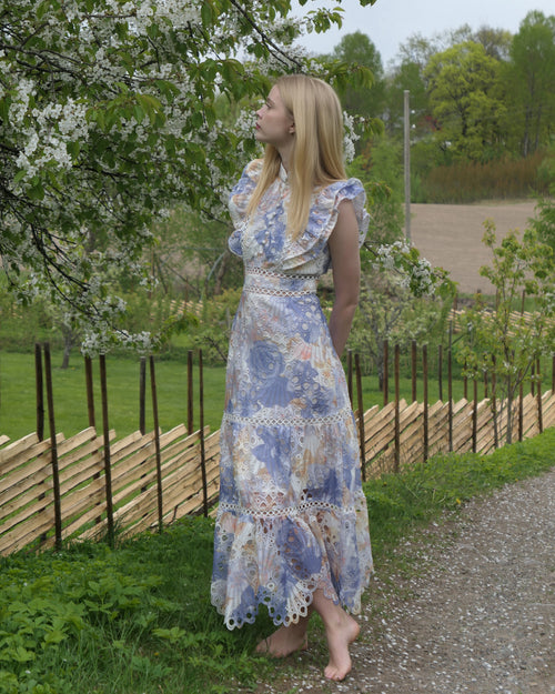 Blue floral broderie anglaise maxi dress with ruffled cap sleeves and tiered scalloped hem
