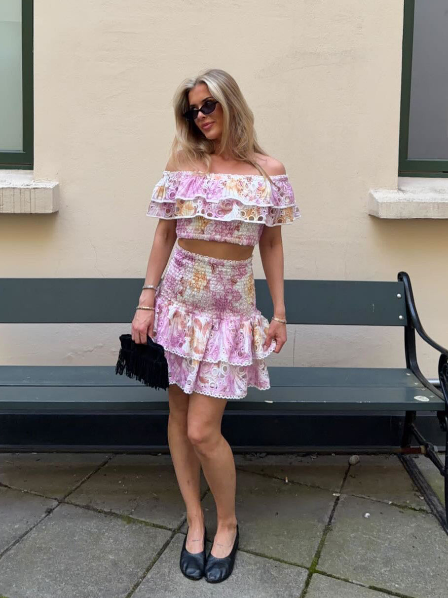 Pink floral broderie anglaise tiered mini skirt with ruffles and smocked waist