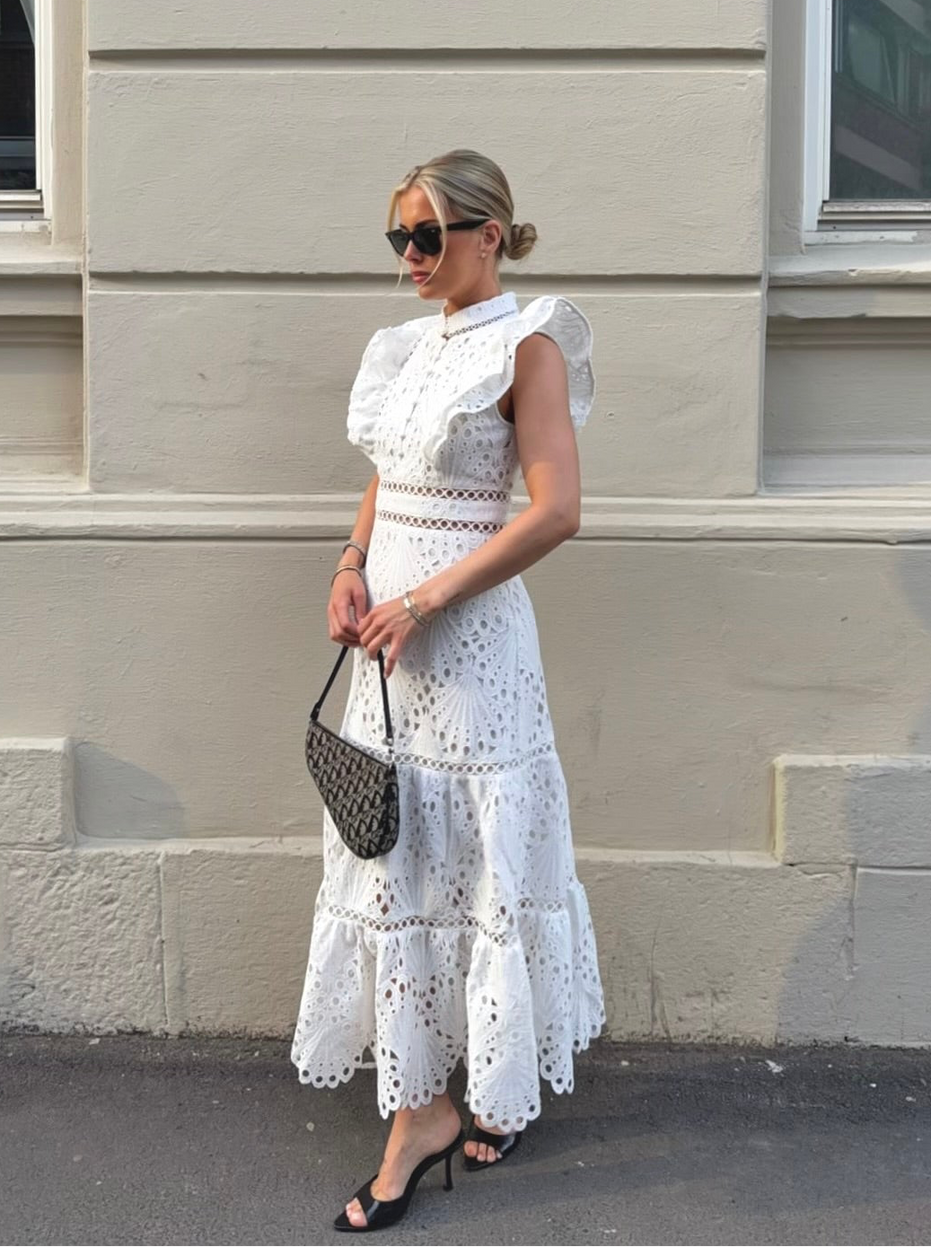 White broderie anglaise maxi dress with ruffled cap sleeves and tiered scalloped hem