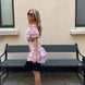 Pink floral broderie anglaise tiered mini skirt with ruffles and smocked waist