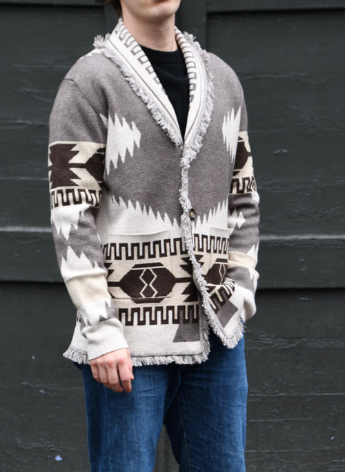 Men's grey and beige merino wool cardigan with geometric Nordic knit and fringed shawl collar