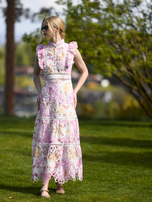 Pink floral broderie anglaise maxi dress with ruffled cap sleeves and tiered scalloped hem
