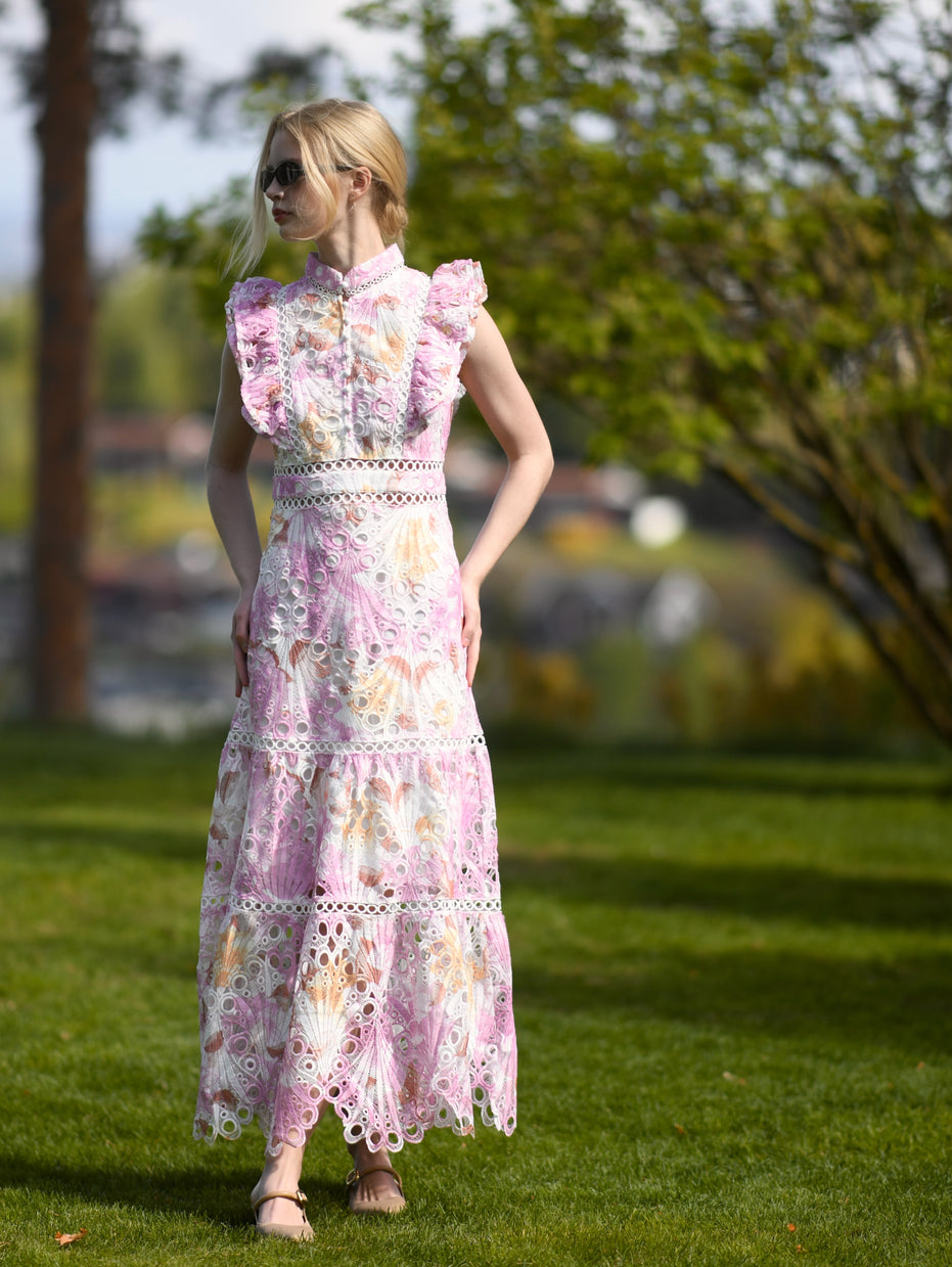 Pink floral broderie anglaise maxi dress with ruffled cap sleeves and tiered scalloped hem