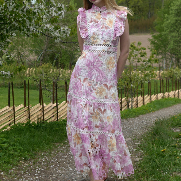 Pink floral broderie anglaise maxi dress with ruffled cap sleeves and tiered scalloped hem