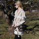 Sand merino wool wrap cardigan with bold geometric Nordic knit and fringed shawl collar