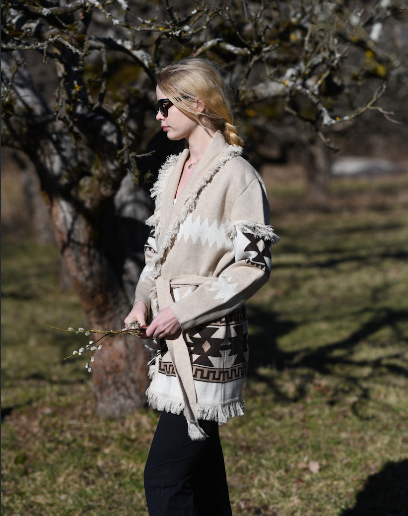 Sand merino wool wrap cardigan with bold geometric Nordic knit and fringed shawl collar