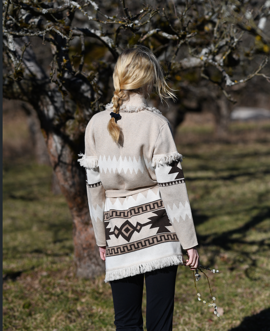 Sand merino wool wrap cardigan with bold geometric Nordic knit and fringed shawl collar