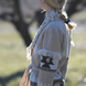 Sand merino wool wrap cardigan with bold geometric Nordic knit and fringed shawl collar