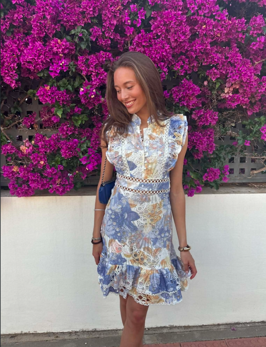 Blue floral broderie anglaise mini dress with ruffled cap sleeves and scalloped hem