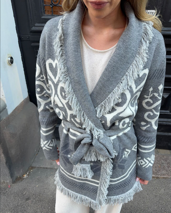 Grey merino wool wrap cardigan with Selbu rose motif and fringed shawl collar